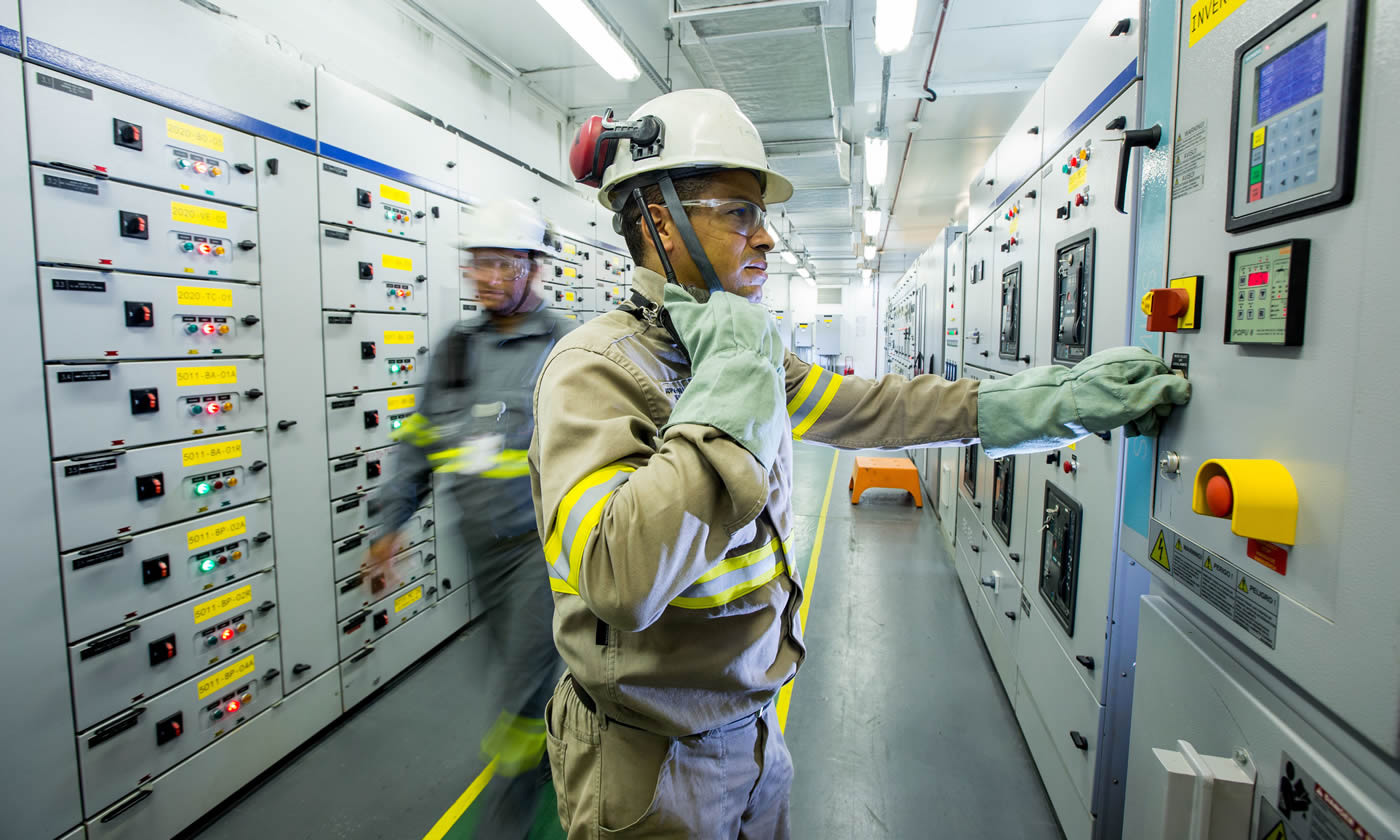 Control Room with staff member moving through